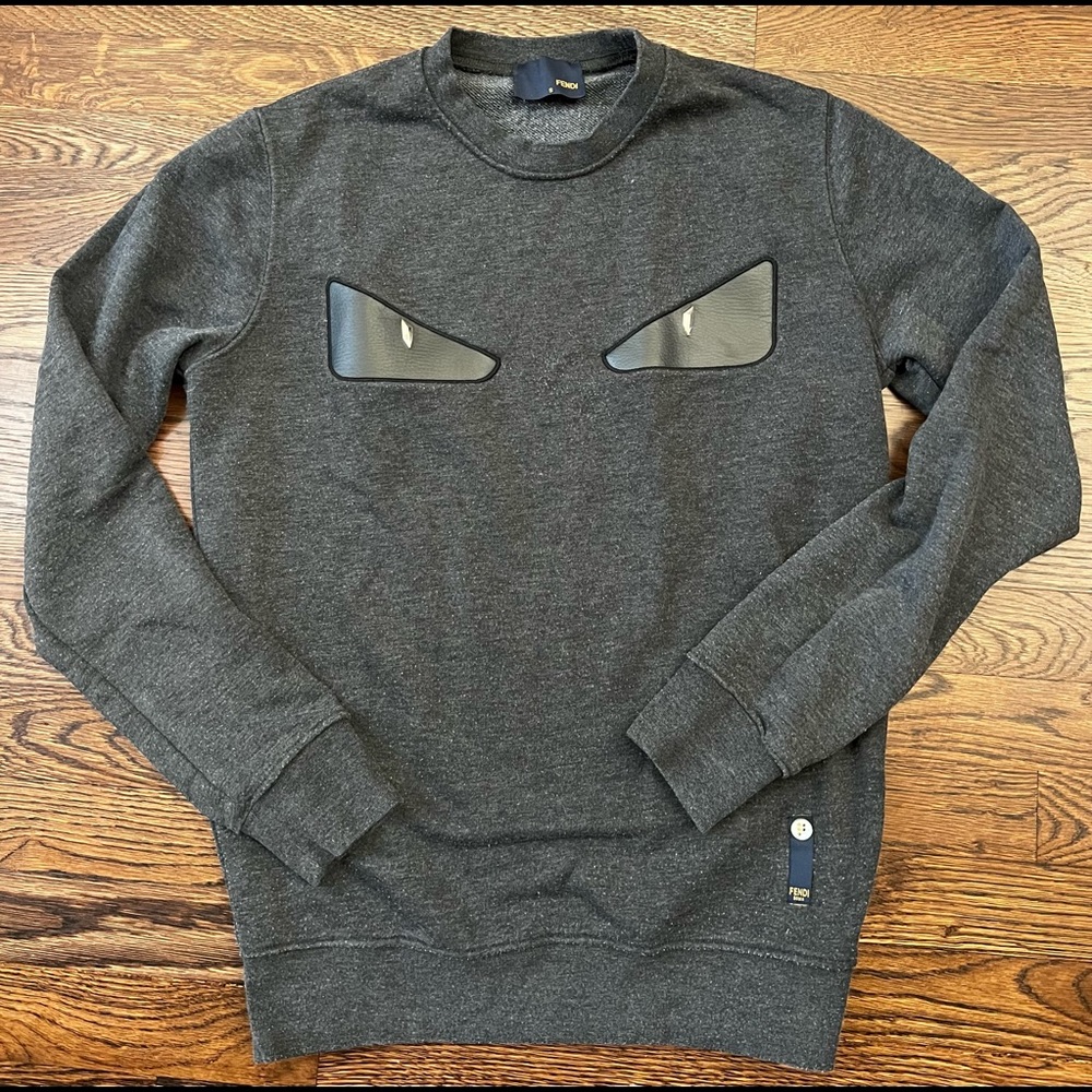 Mens size Small sweatshirt with Leather studded eyes! Fits like a womens medium!